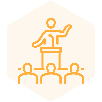 A person speaking at a podium to a group of guests icon in a hexagon shape