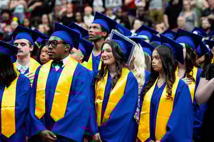 students at the graduation ceremony in their caps and gowns